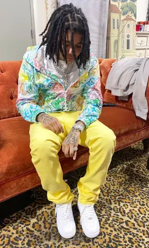 Young M.A wearing Louis Vuitton jacket