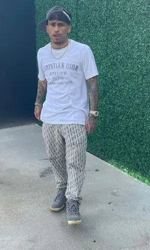 Bryant Mayers wearing Dior pants