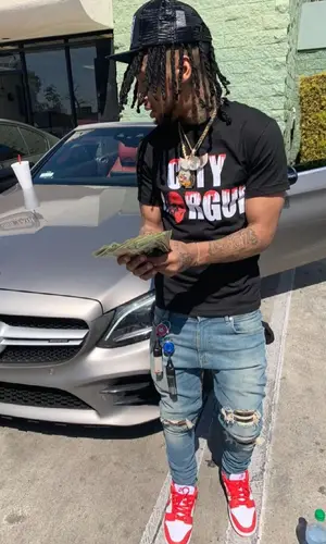 Shordie Shordie wearing Chrome Hearts cap