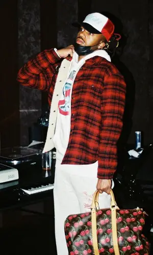 Metro Boomin wearing Louis Vuitton bag