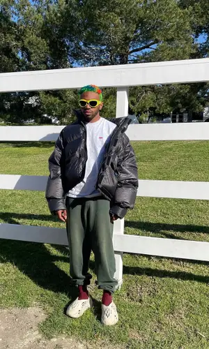 Kevin Abstract wearing Supreme t-shirt