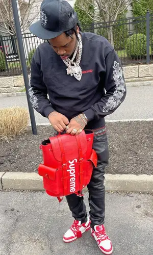 Fivio Foreign wearing Chrome Hearts cap