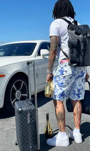 Young M.A wearing Louis Vuitton bag