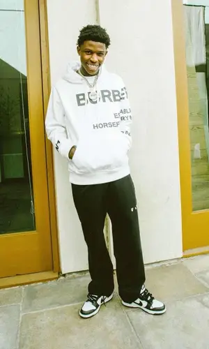 Quando Rondo wearing Burberry hoody