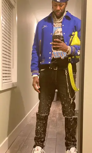 2 Chainz wearing Louis Vuitton bag