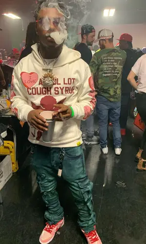 Splurge wearing Nike sneakers