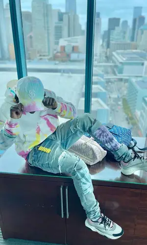 Jackboy wearing Dior backpack