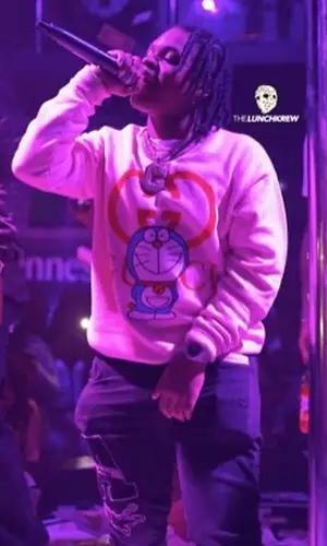 42 Dugg wearing Gucci sweatshirt