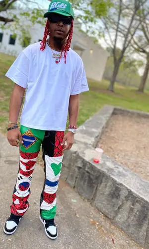 Lil Keed wearing RoyGBiv cap