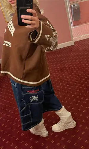 Billie Eilish’s Outfit in Kam Vercetti Sweater, Converse Boots & No Name Socks (2021)