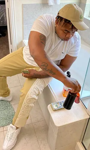 Big Yavo wearing Lacoste cap