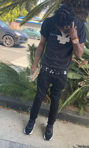 Lil Tjay wearing Valentino belt