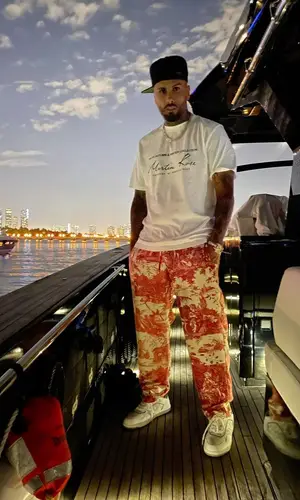 Nicky Jam wearing Pierre Louis Mascia pants