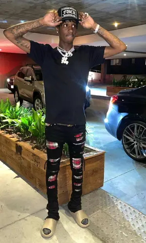 Yung Mal wearing Evol shorts