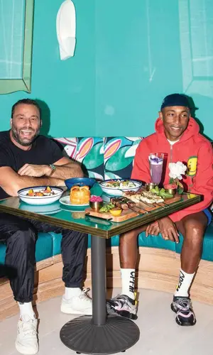 Pharrell Williams wearing Cactus Plant Flea Market sweatshirt