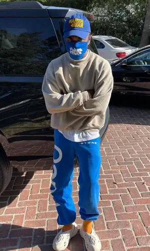Kevin Abstract wearing Holiday cap