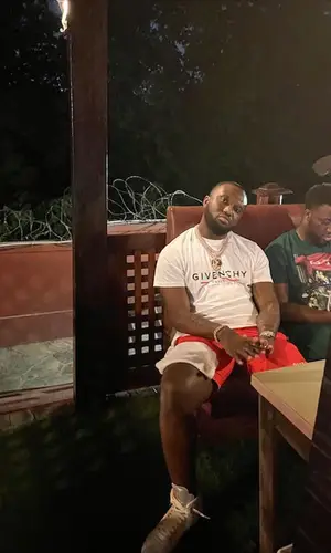 Headie One wearing Givenchy shorts