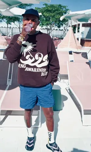 Pharrell Williams wearing Cactus Plant Flea Market sweatshirt