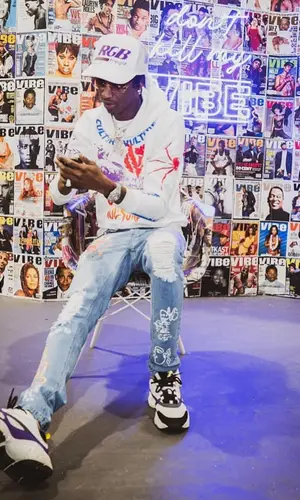 Yung Mal wearing Culture Vulture Garments hoody