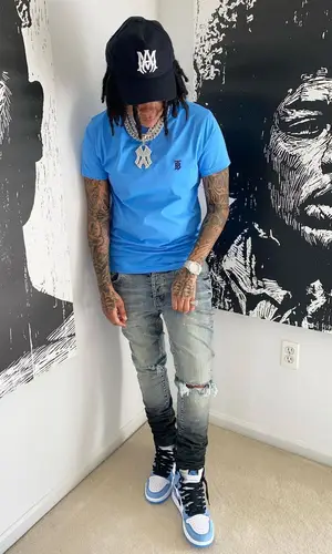 Young M.A wearing Burberry t-shirt