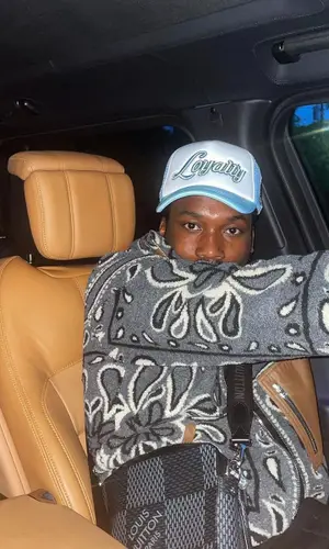 Meek Mill wearing Louis Vuitton bag