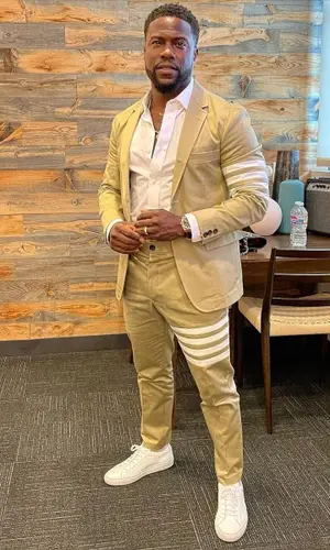 Kevin Hart wearing Thom Browne trousers