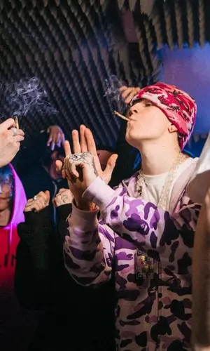SODA LUV’s Outfit in Bape Hoodie, Stone Island Pants & Automatic Vertical Hat (2021)