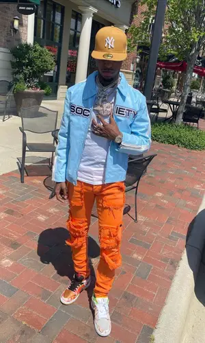 Toosii wearing Society jacket