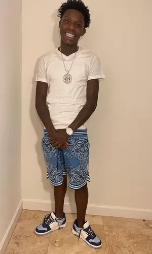 Quando Rondo wearing Amiri shorts