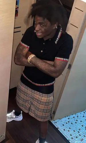Kodak Black wearing Burberry shirt