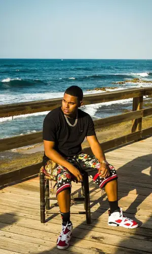 Myke Towers wearing Chrome Hearts sock