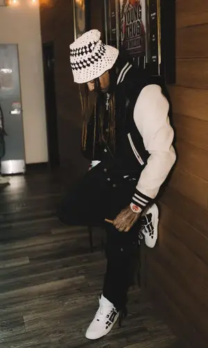 Wheezy wearing Amiri hat