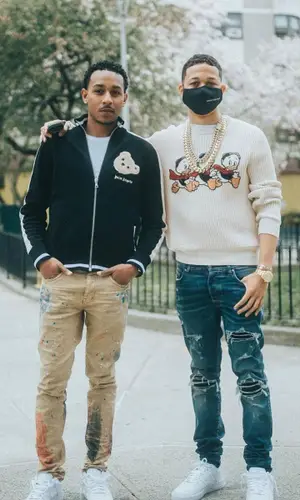 Lil Bibby’s Outfit in Disney Sweater, Amiri Jeans & Gucci (2021)