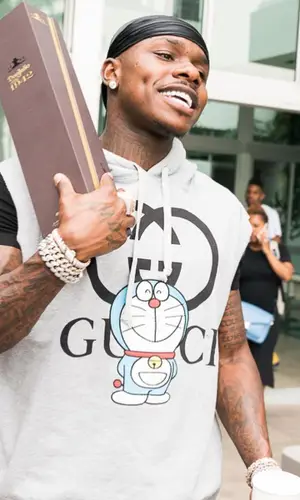 DaBaby wearing Louis Vuitton bag