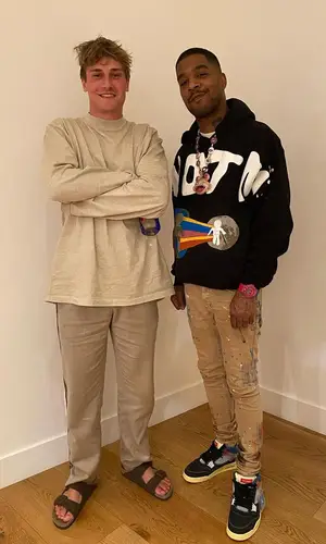 Kid Cudi’s Outfit in Cactus Plant Flea Market Hoodie, Purple Brand Jeans & Bape Watch (2021)