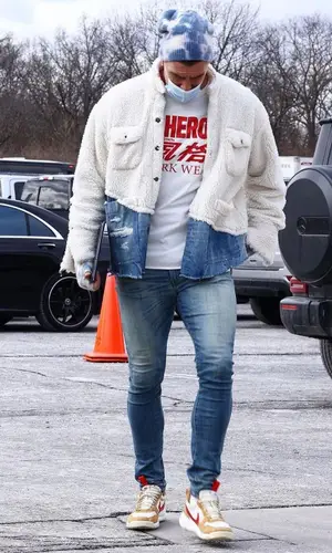 Travis Kelce wearing Amiri jeans