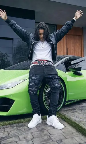 Young M.A wearing Amiri jeans