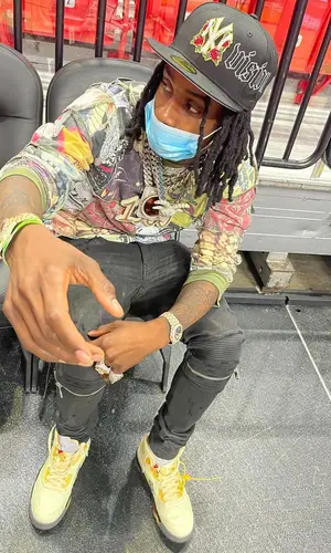 Polo G wearing Supreme top