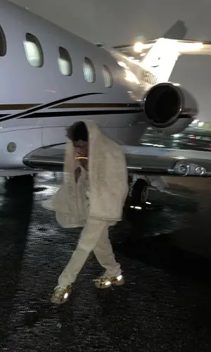 Kodak Black wearing Gucci sweater