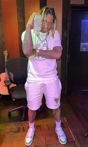 Lil Durk wearing Casablanca shorts