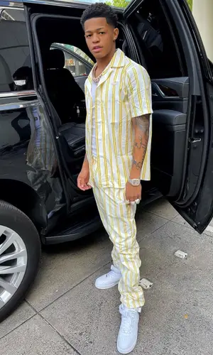 YK Osiris wearing Lacoste pants
