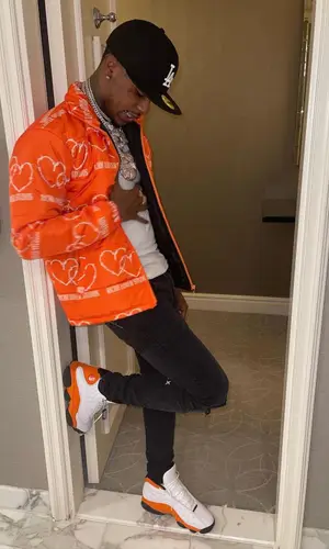Toosii wearing Richh Lover jacket
