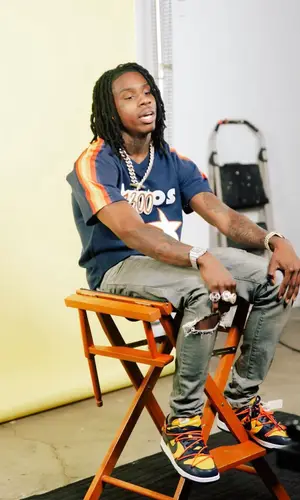 Polo G wearing Mitchell & Ness jersey