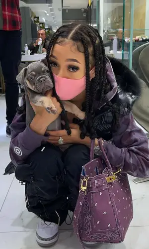 Coi Leray wearing Bape hoody