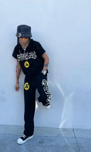 Coi Leray wearing 730la hat
