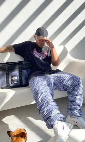Feid wearing Feid Merch t-shirt