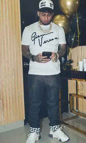 Bryant Mayers wearing Versace jeans