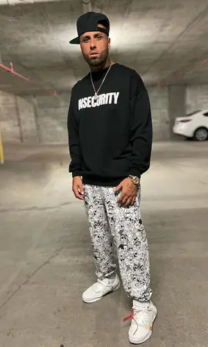 Nicky Jam wearing Vetements pants