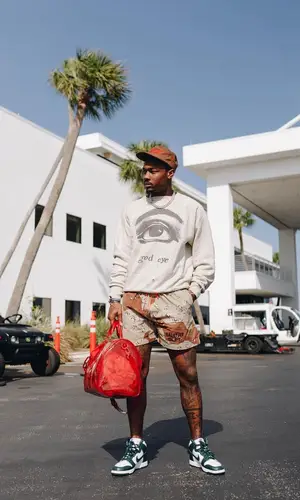 Stefon Diggs wearing Louis Vuitton bag