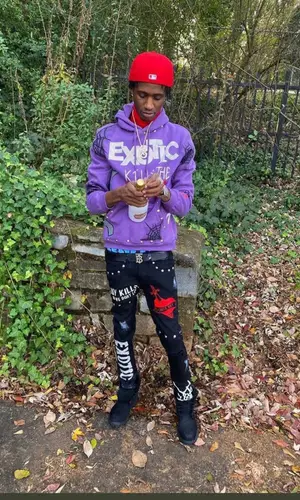 Yung Mal wearing Exotic Apparel hoody